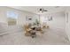 Bonus room with plush carpeting, comfortable seating, ceiling fan, and plenty of natural light at 9911 E Telemetry Dr, Mesa, AZ 85212