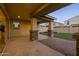 Covered patio featuring stone pillars and access to a well-manicured backyard at 9911 E Telemetry Dr, Mesa, AZ 85212