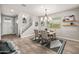 Dining room with light gray walls, a modern chandelier, and staircase in background at 9911 E Telemetry Dr, Mesa, AZ 85212