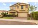 Inviting two-story home with a two-car garage, neat landscaping, and a paved driveway at 9911 E Telemetry Dr, Mesa, AZ 85212
