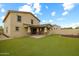 Exterior view of home featuring well-maintained yard and covered patio at 9911 E Telemetry Dr, Mesa, AZ 85212