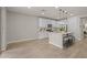 Bright open kitchen featuring a large island with seating, stainless appliances, and white cabinetry at 9911 E Telemetry Dr, Mesa, AZ 85212