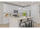 Modern kitchen with a large island, granite countertops, stainless steel appliances, and white cabinetry at 9911 E Telemetry Dr, Mesa, AZ 85212