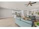Open-concept living area with tile flooring, a ceiling fan, and a view into the kitchen at 9911 E Telemetry Dr, Mesa, AZ 85212