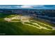 A beautifully landscaped park features a modern skate park, grassy areas, and easy access to nearby community buildings at 9911 E Telemetry Dr, Mesa, AZ 85212