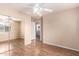 Bedroom features mirrored closet, natural light and adjoins laundry room at 10 N 87Th Dr, Tolleson, AZ 85353