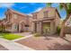 Two-story home showcasing stone accents and low-water landscaping; part of a neighborhood at 10 N 87Th Dr, Tolleson, AZ 85353