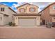 Charming two-story home with red shutters and large two car garage at 10 N 87Th Dr, Tolleson, AZ 85353