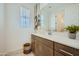 Well-lit bathroom featuring a spacious vanity, modern fixtures, and decorative accents at 10049 E Ulysses Ave, Mesa, AZ 85212