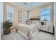 Inviting bedroom features large windows, neutral walls, and a comfortable bed at 10049 E Ulysses Ave, Mesa, AZ 85212