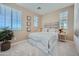 Inviting bedroom features large windows, neutral walls, and a comfortable bed at 10049 E Ulysses Ave, Mesa, AZ 85212