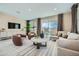 Stylish living room with plush seating, neutral decor, contemporary accents, lots of natural light, and outdoor access at 10049 E Ulysses Ave, Mesa, AZ 85212