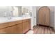 Modern bathroom with double vanity and unique arched linen cabinet at 10156 E Talon Ave, Mesa, AZ 85212