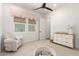 Charming Bedroom with plush chair, changing table, and ball pit for the little ones at 10156 E Talon Ave, Mesa, AZ 85212