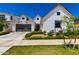 Beautifully landscaped new construction home features a two-car garage and white exterior at 10156 E Talon Ave, Mesa, AZ 85212