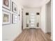 Bright foyer with wood floors and a modern white door with sidelights at 10156 E Talon Ave, Mesa, AZ 85212