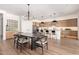 Bright kitchen with modern appliances, a kitchen island, and an adjacent dining area at 10156 E Talon Ave, Mesa, AZ 85212