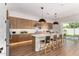 Kitchen boasts stainless steel appliances, a center island, and a sliding glass door at 10156 E Talon Ave, Mesa, AZ 85212