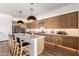 Stylish kitchen featuring an island with seating and modern stainless steel appliances at 10156 E Talon Ave, Mesa, AZ 85212