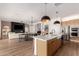 Open-concept floorplan connects the kitchen, dining area, and living room at 10156 E Talon Ave, Mesa, AZ 85212
