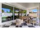 Patio showcases outdoor dining with views of the lush, well-maintained backyard at 10156 E Talon Ave, Mesa, AZ 85212