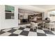 A view of the open patio, dining area, and kitchen through sliding glass doors at 10156 E Talon Ave, Mesa, AZ 85212
