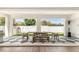Covered patio features a dining table with black and white checkered tile flooring at 10156 E Talon Ave, Mesa, AZ 85212
