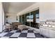 A covered patio with an outdoor dining area, grill and view of the backyard at 10156 E Talon Ave, Mesa, AZ 85212
