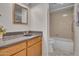 Functional bathroom featuring a vanity with sink, and a tub/shower combo with grab bar at 10235 N 31St St # 15, Phoenix, AZ 85028