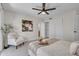 Cozy bedroom featuring a plush bed, ample closet space, and a relaxing seating area at 10235 N 31St St # 15, Phoenix, AZ 85028