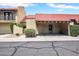 Charming townhome with a red tile roof, covered parking, and desert landscaping at 10235 N 31St St # 15, Phoenix, AZ 85028