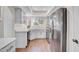 Bright kitchen with white cabinets, stainless steel appliances, and wood-look flooring at 10235 N 31St St # 15, Phoenix, AZ 85028
