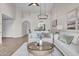 Well-lit living room with comfortable seating, stylish coffee table, and views into the dining area at 10235 N 31St St # 15, Phoenix, AZ 85028