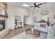 Inviting living room featuring high ceilings, fireplace, comfortable seating, and a modern decor at 10235 N 31St St # 15, Phoenix, AZ 85028