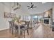Open concept living space with stylish dining area, fireplace and sliding doors at 10235 N 31St St # 15, Phoenix, AZ 85028