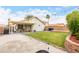 Enjoy the shaded patio and grassy backyard, perfect for outdoor relaxation and entertainment with desert landscaping at 1130 W Kingbird Dr, Chandler, AZ 85286