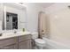Neutral bathroom featuring shower over tub and neutral sink and cabinets at 1130 W Kingbird Dr, Chandler, AZ 85286