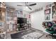 Secondary bedroom with personal decorations, ceiling fan and wood look flooring at 1130 W Kingbird Dr, Chandler, AZ 85286