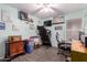 Spare bedroom featuring a desk, treadmill, light walls, and wood look flooring at 1130 W Kingbird Dr, Chandler, AZ 85286