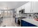 Contemporary kitchen with stainless steel appliances, two-tone cabinets, and modern backsplash at 1130 W Kingbird Dr, Chandler, AZ 85286