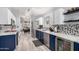 Well-lit kitchen featuring stainless steel appliances, two-tone cabinets, and open layout at 1130 W Kingbird Dr, Chandler, AZ 85286