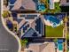 Aerial view of a house with solar panels, pool, spa, outdoor kitchen and pristine landscaping at 11844 W Nadine Way, Peoria, AZ 85383