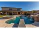 Stunning backyard featuring a luxurious pool with waterfall, diving board, and a built-in spa for relaxation at 11844 W Nadine Way, Peoria, AZ 85383