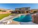 Beautiful backyard showcasing a pool with waterfall feature, diving board, and spa, perfect for outdoor enjoyment at 11844 W Nadine Way, Peoria, AZ 85383