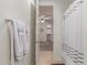 Bathroom with decorative towels, walk-in shower, and access to the bedroom at 11844 W Nadine Way, Peoria, AZ 85383