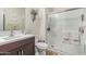 Bathroom featuring a glass shower with tile surround at 11844 W Nadine Way, Peoria, AZ 85383