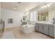 Bathroom features a soaking tub, dual sinks, and ample counter space at 11844 W Nadine Way, Peoria, AZ 85383