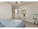 Relaxing bedroom with ceiling fan, soft carpet, and stylish accents at 11844 W Nadine Way, Peoria, AZ 85383