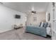 Bright bedroom with plush carpet, large bed, and TV at 11844 W Nadine Way, Peoria, AZ 85383