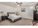 Inviting bedroom boasts a comfortable bed, stylish furnishings, and soft carpeting for a restful retreat at 11844 W Nadine Way, Peoria, AZ 85383